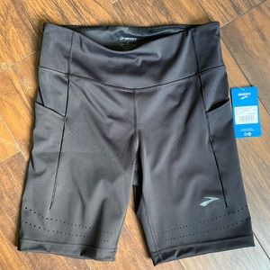 Brooks size large 8in running shorts. Never worn. Tags still on.
